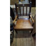 An unusual George III mahogany Mendlesham type elbow chair, with a lateral drawer to the seat,