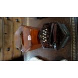 An antique pierced wood hexagonal concertina, bearing paper label inscribed 'J B Copplestone,