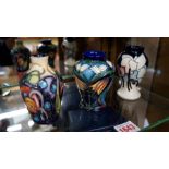 Three Moorcroft small vases, circa 2001-4 , each tube lined with stylized flowers,