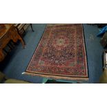 A fine Persian Kashan rug, having blue floral field with large central medallion, 210 x 135cm.