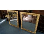 A pair of antique carved gesso framed rectangular wall mirrors, moulded with leaves, 80cm x 67cm.