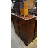 An early 19th century figured mahogany side cabinet, with a pair of panelled doors, 99cm wide.