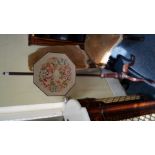 An old mahogany pole screen, with octagonal needlework panel and tripod base.