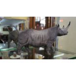 A Coalport Rhinoceros, 25cm long. Condition Report: Tip of tail restuck.