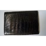 A vintage Asprey black snakeskin travel wallet.