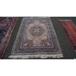 An Indian floral design rug, with large blue central medallion, 219 x 143cm.