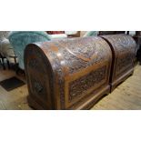 A very near pair of Eastern carved hardwood dome top trunks, 86cm wide.