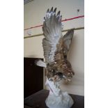 A large Hutschenreuter figure of a bird of prey, modelled by K Tutter, 43.5cm high.