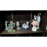 Seven various 19th century Staffordshire pottery figures, to include: a cat,