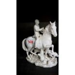 A porcelain figure of a huntsman and hounds, (restored).