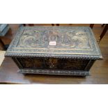 An antique Continental carved walnut and parcel gilt casket, 44cm wide.