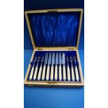 A cased set of twelve Victorian silver fruit knives and forks having ivory handles,