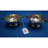 Two silver bonbon dishes each decorated with horse head handles, Birmingham 1953 and 1959,