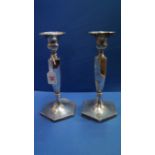 A pair of Edwardian polygonal silver candlesticks, by Goldsmiths & Silversmiths Company Ltd,