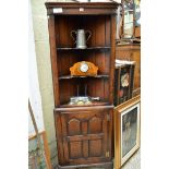 A good reproduction oak standing corner cupboard, 64.5cm wide.