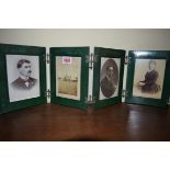 A green leather four fold photograph frame.