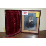 A daguerreotype of a bewigged gentleman, in leather case.