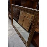 A large giltwood framed rectangular wall mirror, 125 x 173.5cm.