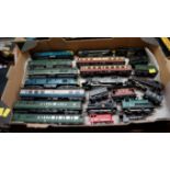 A collection of Hornby and Triang OO gauge locomotives and wagons.