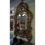 An 18th/19th century carved giltwood framed wall mirror, 98 x 59cm.