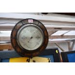 An oak framed aneroid barometer, 26.5cm diameter.