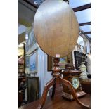 A 19th century mahogany and fruitwood oval tilt-top tripod table, 59cm wide.