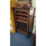 A 19th century Burr walnut, ebonized and parcel gilt music cabinet, 64cm wide.