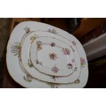 A graduated set of three Victorian porcelain meat plates, largest 55cm wide.