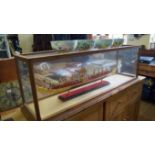 A good walnut and glazed display cabinet, 45cm high x 136cm wide x 37.