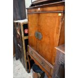 A reproduction walnut and crossbanded cabinet on stand, in the early 18th century style, 73cm wide.