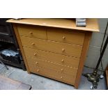 A contemporary oak veneered chest of drawers, 105cm wide.