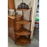 A Victorian walnut and inlaid four tier corner whatnot, 140cm high.