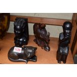 A collection of African and Oriental carved wood and other figures.