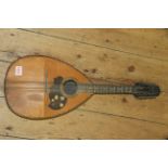 An antique flat back mandolin.