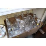 A collection of fourteen clear glass decanters, to include: a Baccarat etched example,