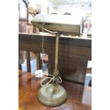 An old patinated brass desk lamp.