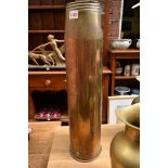 A large brass shell stamped with broad arrow and 1966,