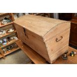 An antique pine dome top trunk, 105cm wide.