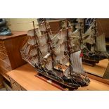 A stained wood model of an 18th century galleon, total length 88cm.