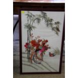 A collection of eight Oriental silk embroidered pictures, largest 71 x 33cm.