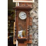 An antique walnut and beech wood Vienna style wall clock, 96cm high.