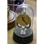 A vintage Bulle electromagnetic timepiece, on Bakelite plinth with glass dome, total height 26.5cm.