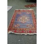 A fine Persian rug, possibly Tabriz, with large central flower vase design,