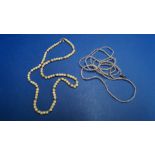 A natural seed pearl necklace, 84cm; together with an ivory bead necklace.