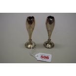 A pair of Chinese silver vases, by Wang Hing, 9.5cm high, loaded.