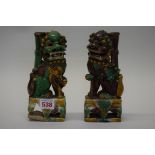 A pair of Chinese Sancai glazed dogs of fo, 20.5cm high, (s.d.).