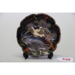 A tortoiseshell lobed dish, decorated in gilt with a bird in flight, 12cm diameter.