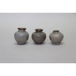 Three small Chinese crackle glaze jars, largest 6cm high.