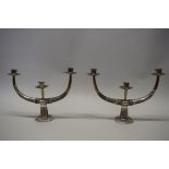 A pair of Malaysian silver twin branch candelabra, 32.5cm wide, loaded.