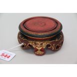 A Chinese red painted and parcel gilt carvod wood stand, 10.5cm diameter.